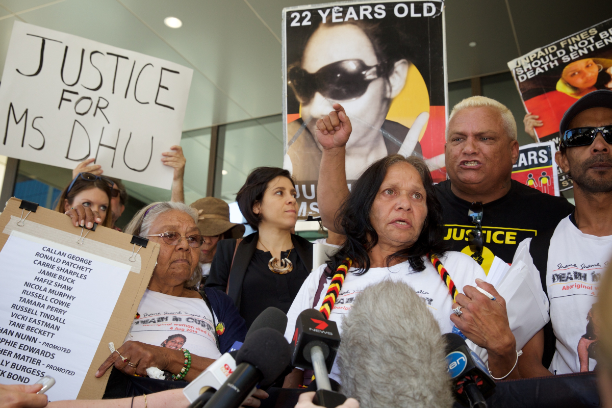 Carol Roe (L) grandmother and Della Roe (C), mother of Ms Dhu outside the coroner's court in Perth on Friday, Dec. 16, 2016. (Richard Wainwright (AAP))